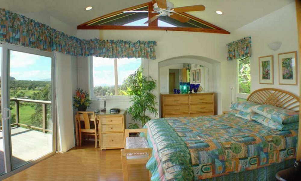 Plush king-size beds in a honeymoon cottage on Maui