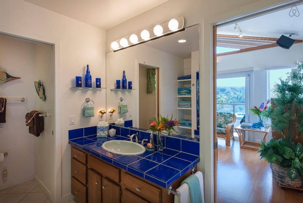 Bath is accented with cobalt-blue glass tile